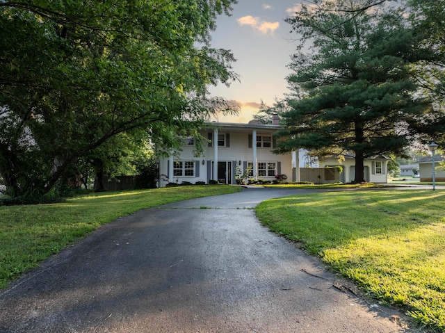 600 E Boone St, Ash Grove, MO 65604 - neoclassical home with asphalt driveway and a lawn