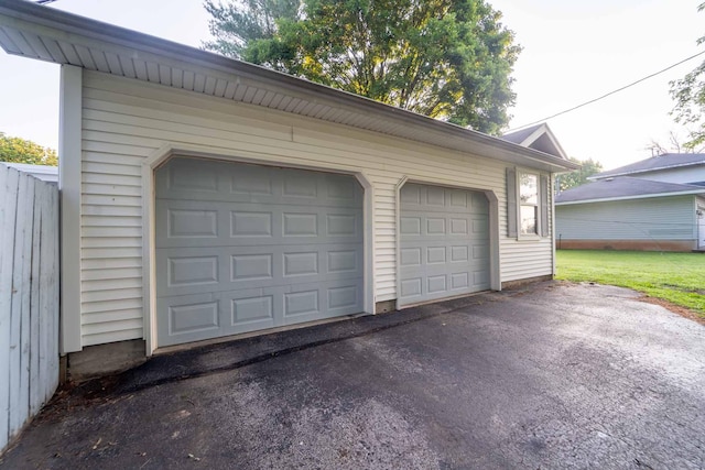 600 E Boone St, Ash Grove, MO 65604 - garage featuring asphalt driveway