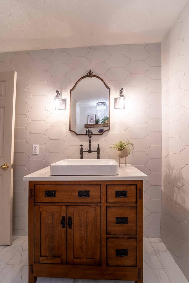 600 E Boone St, Ash Grove, MO 65604 - bathroom with vanity and marble look tile flooring