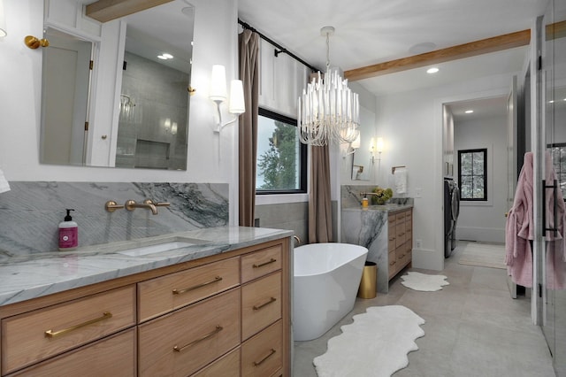 12451 State Highway 174, Billings, MO 65610 - bathroom featuring vanity, a freestanding tub, a chandelier, beamed ceiling, and washer / dryer