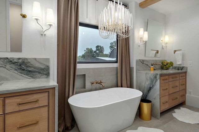 12451 State Highway 174, Billings, MO 65610 - full bathroom with a freestanding bath, vanity, a chandelier, tile patterned floors, and tile walls