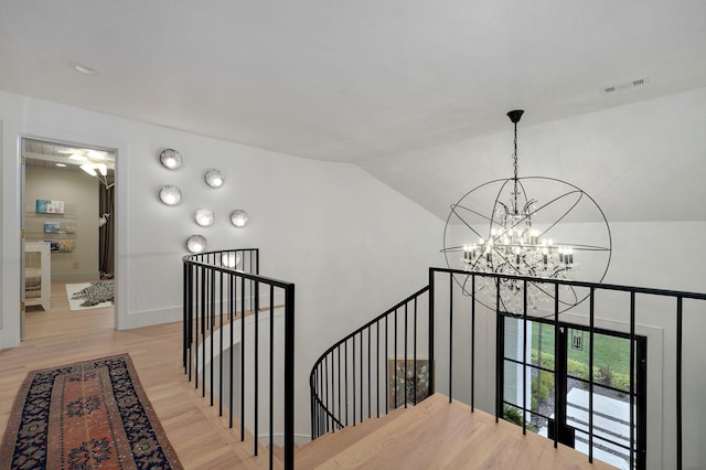 12451 State Highway 174, Billings, MO 65610 - stairs featuring a chandelier, wood finished floors, and vaulted ceiling