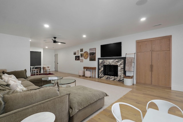 12451 State Highway 174, Billings, MO 65610 - living area with recessed lighting, light wood-style flooring, a ceiling fan, and a fireplace