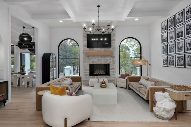 12451 State Highway 174, Billings, MO 65610 - living room with wood finished floors, a chandelier, beamed ceiling, a stone fireplace, and recessed lighting