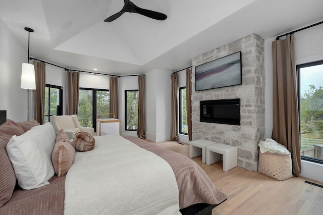 12451 State Highway 174, Billings, MO 65610 - bedroom featuring light wood-style floors, a fireplace, a ceiling fan, and lofted ceiling
