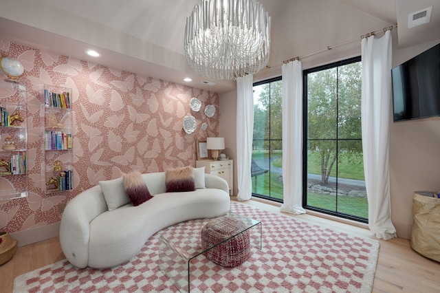 12451 State Highway 174, Billings, MO 65610 - living room with wallpapered walls, a chandelier, light wood-style floors, recessed lighting, and lofted ceiling