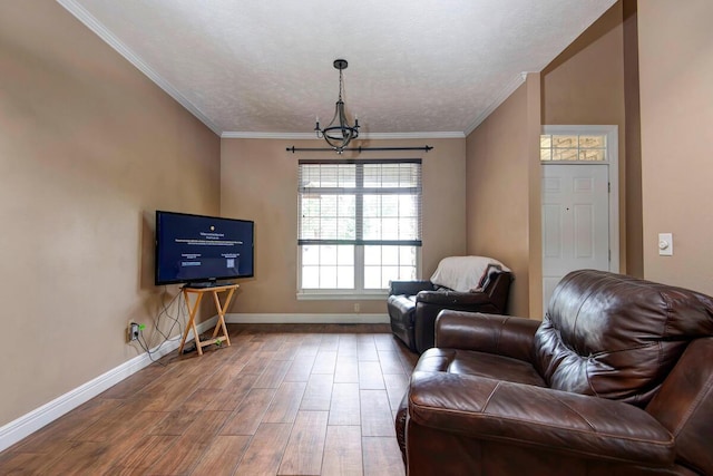 1108 N 18th Ave, Ozark, MO 65721 - living area featuring wood finished floors, a chandelier, and ornamental molding