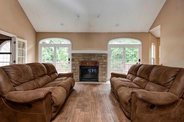 1108 N 18th Ave, Ozark, MO 65721 - living room featuring hardwood / wood-style flooring, a fireplace, plenty of natural light, and high vaulted ceiling