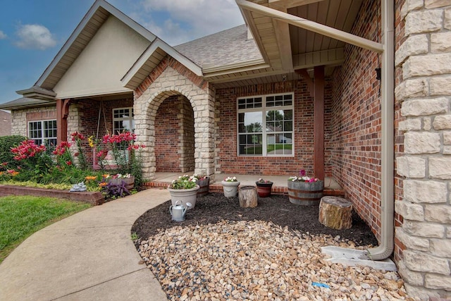 1108 N 18th Ave, Ozark, MO 65721 - doorway to property with brick siding, roof with shingles, and stone siding
