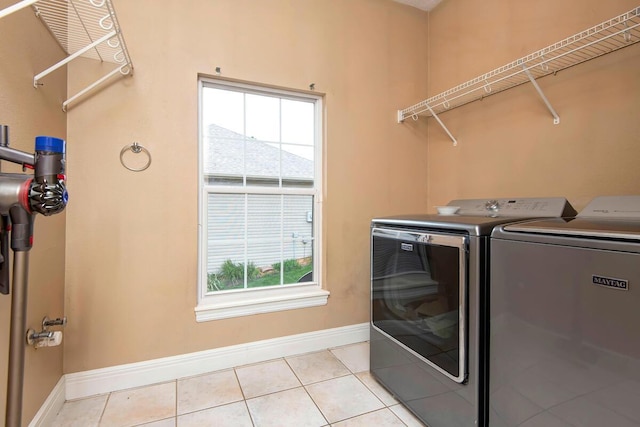1108 N 18th Ave, Ozark, MO 65721 - washroom with washing machine and dryer, plenty of natural light, and light tile patterned floors