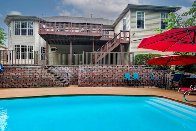 1108 N 18th Ave, Ozark, MO 65721 - outdoor pool with stairway, a wooden deck, and a patio area