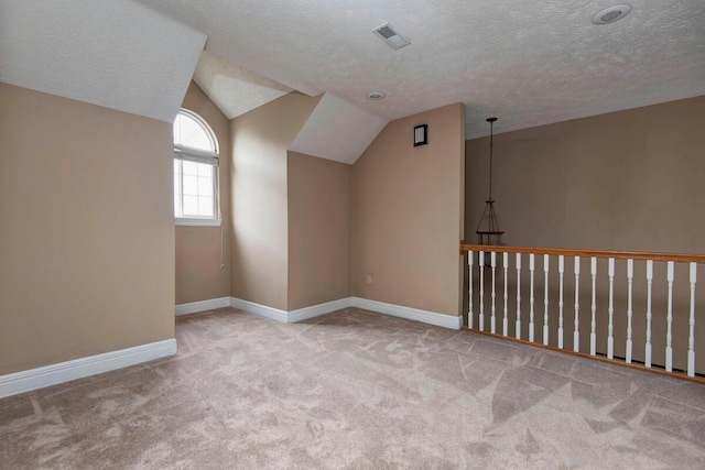 1108 N 18th Ave, Ozark, MO 65721 - bonus room with carpet floors, lofted ceiling, and a textured ceiling