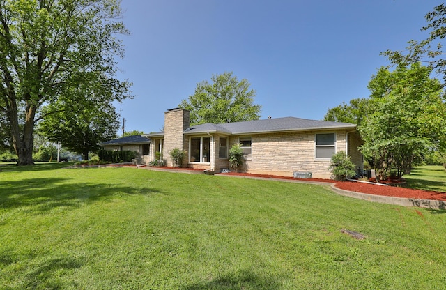 2225 N Plainview Ave, Springfield, MO 65803 - rear view of house with a chimney and a lawn