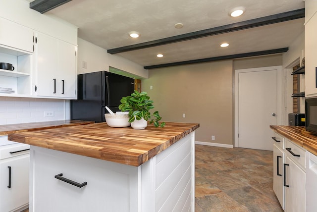 2225 N Plainview Ave, Springfield, MO 65803 - kitchen with wooden counters, freestanding refrigerator, backsplash, white cabinets, and stone finish floors