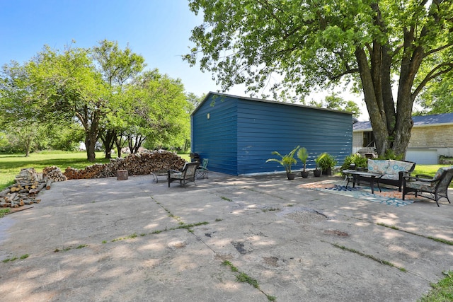 2225 N Plainview Ave, Springfield, MO 65803 - view of patio featuring an outdoor hangout area and an outdoor structure