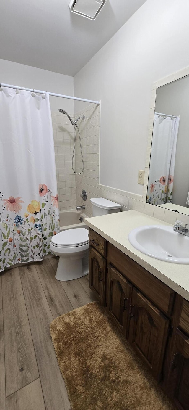 2782 W Swan St, Springfield, MO 65807 - bathroom with vanity, shower / bath combo, and wood finished floors