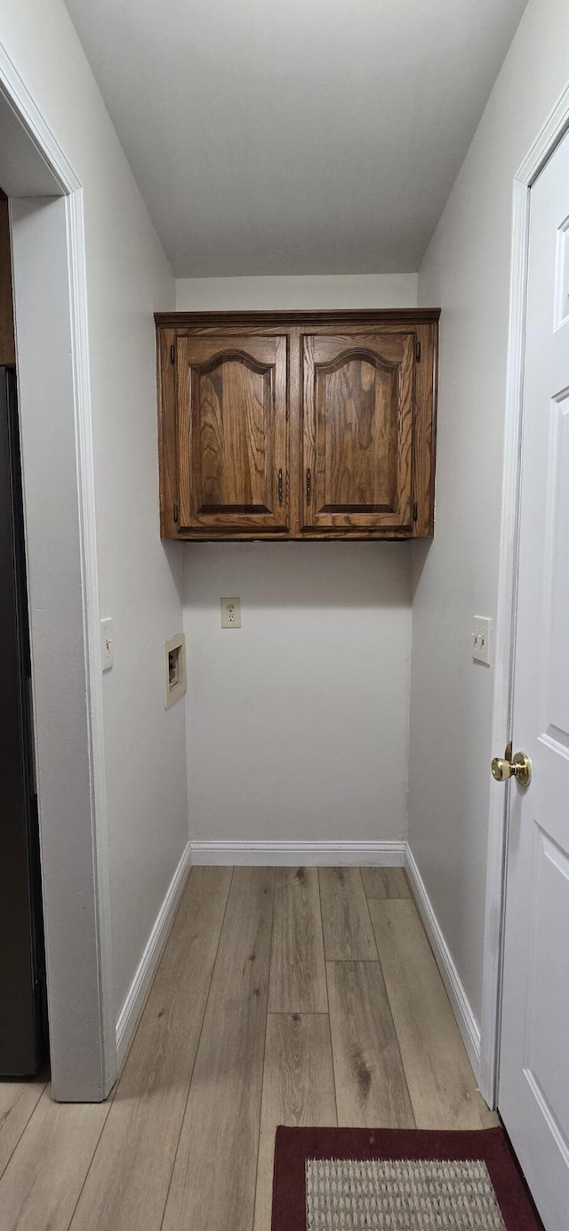 2782 W Swan St, Springfield, MO 65807 - washroom featuring cabinet space, light wood-style floors, and washer hookup