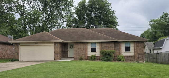 2782 W Swan St, Springfield, MO 65807 - single story home with brick siding, concrete driveway, an attached garage, and roof with shingles