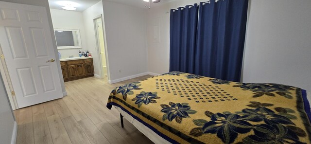 2782 W Swan St, Springfield, MO 65807 - bedroom with light wood-style flooring and ensuite bath