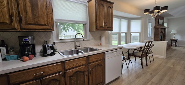 2782 W Swan St, Springfield, MO 65807 - kitchen featuring dishwasher, a chandelier, light countertops, and tasteful backsplash
