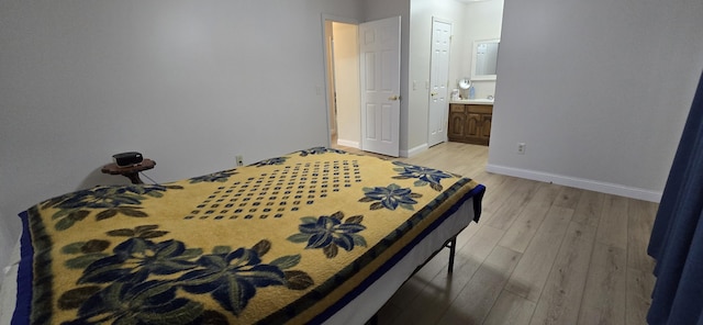 2782 W Swan St, Springfield, MO 65807 - bedroom featuring light wood-style flooring and ensuite bath