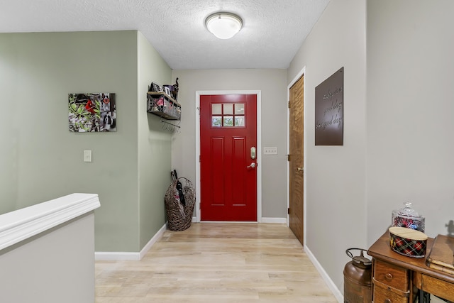 11996 N Farm Rd Unit 119, Brighton, MO 65617 - foyer with light wood-style floors and a textured ceiling