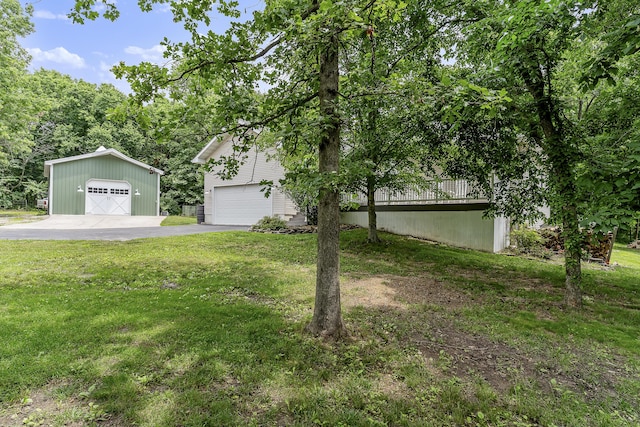 11996 N Farm Rd Unit 119, Brighton, MO 65617 - view of grassy yard featuring an outdoor structure and a garage