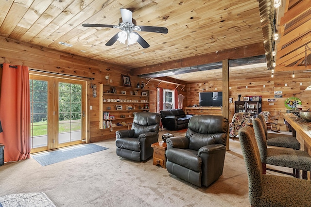 11996 N Farm Rd Unit 119, Brighton, MO 65617 - living room with wooden walls, a wood ceiling with exposed beams, ceiling fan, and carpet flooring