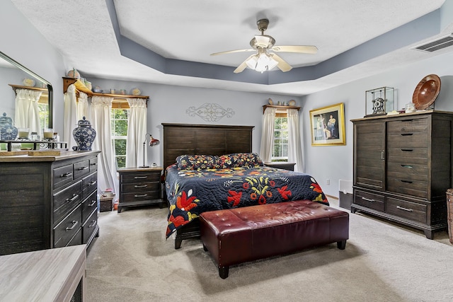 11996 N Farm Rd Unit 119, Brighton, MO 65617 - bedroom featuring light carpet, a tray ceiling, a ceiling fan, and a textured ceiling