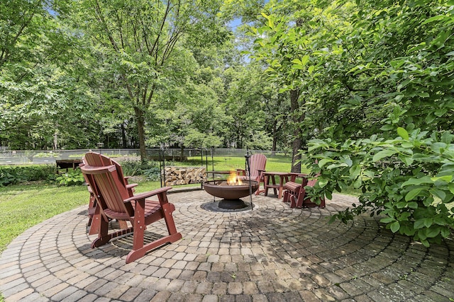 11996 N Farm Rd Unit 119, Brighton, MO 65617 - view of patio / terrace featuring a fire pit and view of wooded area