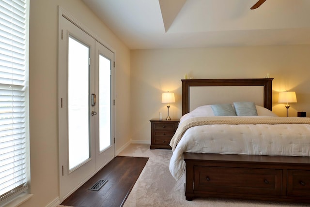 185 Tanner Rd, Branson, MO 65616 - carpeted bedroom featuring multiple windows and ceiling fan