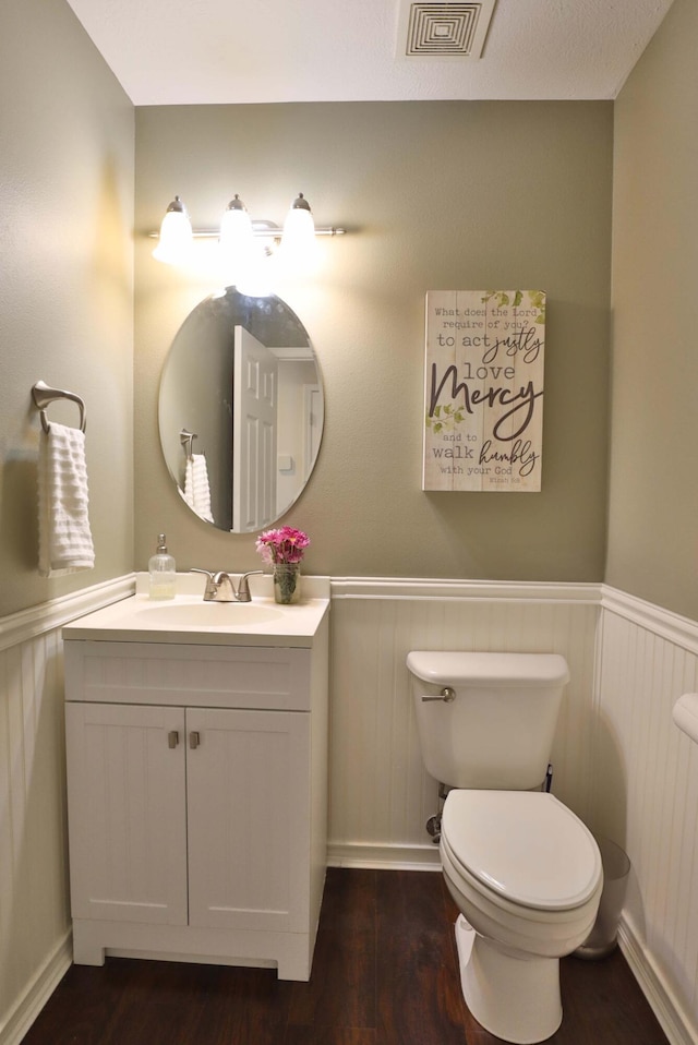 185 Tanner Rd, Branson, MO 65616 - half bathroom with a wainscoted wall, vanity, and wood finished floors