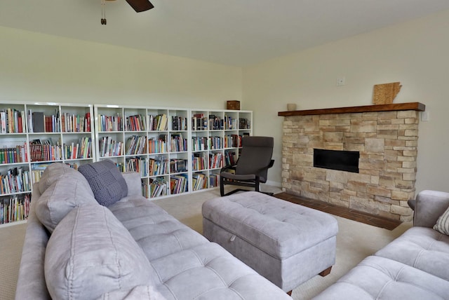 185 Tanner Rd, Branson, MO 65616 - living room featuring carpet floors, ceiling fan, and a fireplace