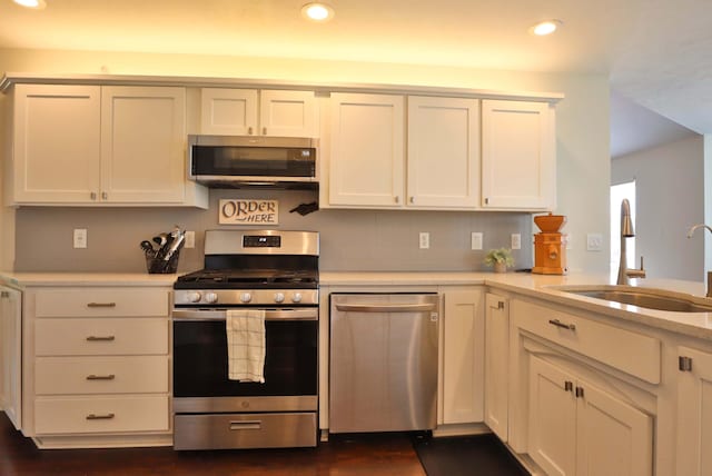 185 Tanner Rd, Branson, MO 65616 - kitchen featuring appliances with stainless steel finishes, recessed lighting, light countertops, white cabinets, and dark wood-type flooring