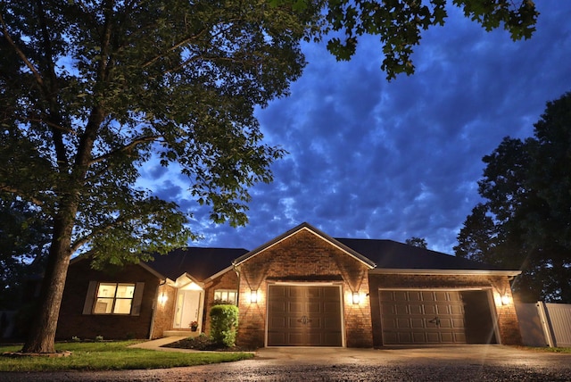 185 Tanner Rd, Branson, MO 65616 - ranch-style home featuring an attached garage, concrete driveway, and brick siding