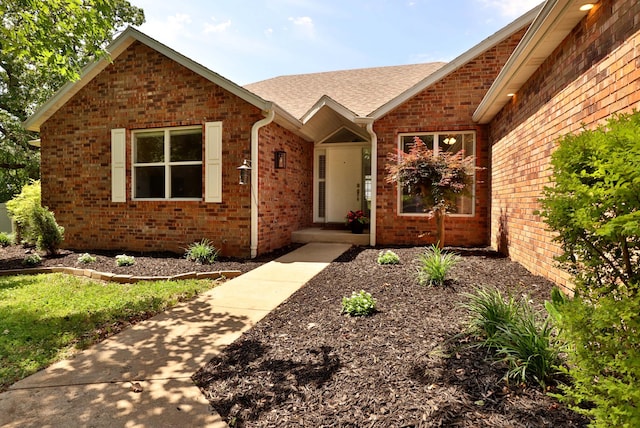 185 Tanner Rd, Branson, MO 65616 - view of front of property with brick siding and roof with shingles