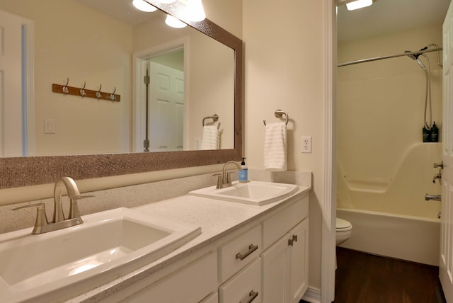 185 Tanner Rd, Branson, MO 65616 - bathroom with double vanity, wood finished floors, and shower / bath combination