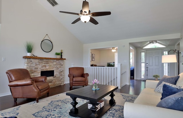 185 Tanner Rd, Branson, MO 65616 - living area with ceiling fan, wood finished floors, a stone fireplace, and high vaulted ceiling