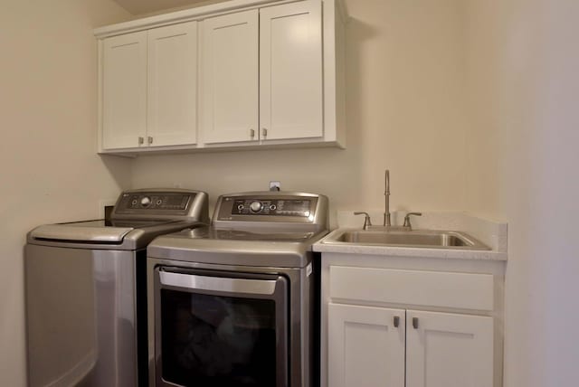 185 Tanner Rd, Branson, MO 65616 - laundry area featuring separate washer and dryer and cabinet space