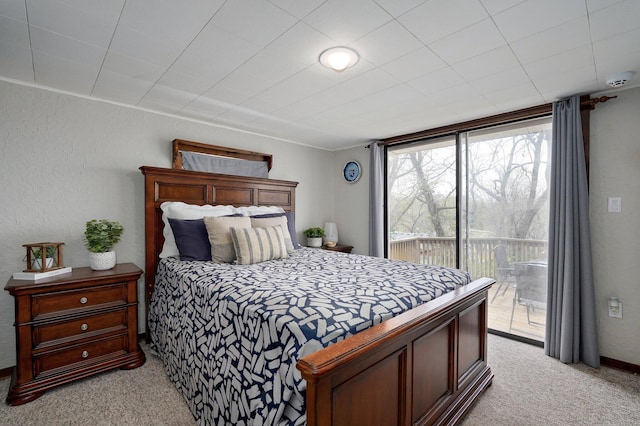 901 S 5th St, Ozark, MO 65721 - bedroom featuring light carpet, access to exterior, and a textured wall
