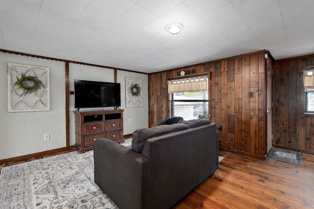 901 S 5th St, Ozark, MO 65721 - living area with wood walls, wood finished floors, and ornamental molding