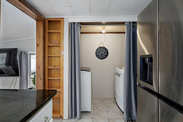 901 S 5th St, Ozark, MO 65721 - kitchen with stainless steel refrigerator with ice dispenser, separate washer and dryer, dark stone counters, light tile patterned floors, and crown molding