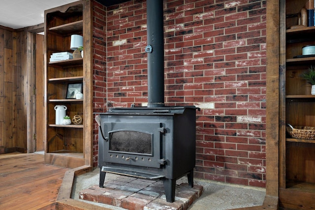 901 S 5th St, Ozark, MO 65721 - detailed view of a wood stove, wood walls, and wood finished floors