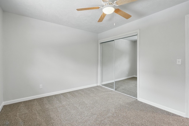 14289 Bethel Rd, Seneca, MO 64865 - unfurnished bedroom with carpet floors, a closet, a ceiling fan, and a textured ceiling