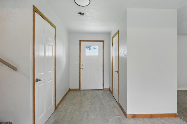14289 Bethel Rd, Seneca, MO 64865 - doorway to outside with light wood-type flooring and baseboards