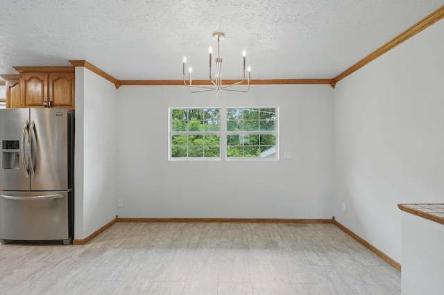 14289 Bethel Rd, Seneca, MO 64865 - unfurnished dining area with a chandelier, crown molding, and a textured ceiling