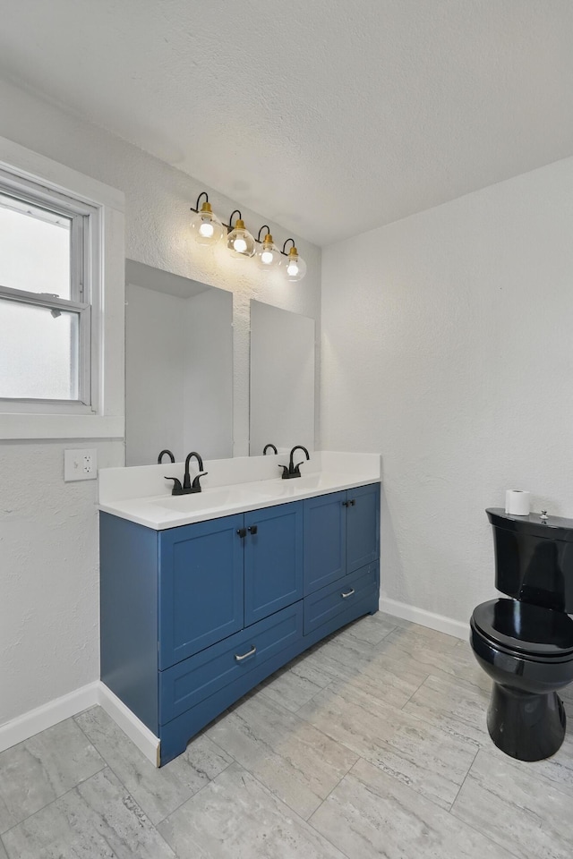 14289 Bethel Rd, Seneca, MO 64865 - bathroom with double vanity and a textured ceiling