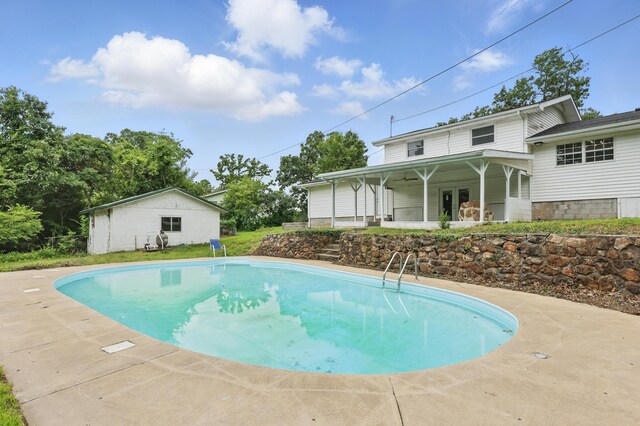 14289 Bethel Rd, Seneca, MO 64865 - swimming pool with a patio area, an outbuilding, and ceiling fan