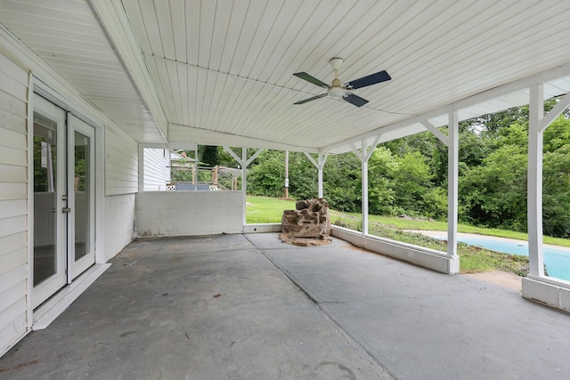 14289 Bethel Rd, Seneca, MO 64865 - view of patio with french doors, ceiling fan, a pool, and an attached carport