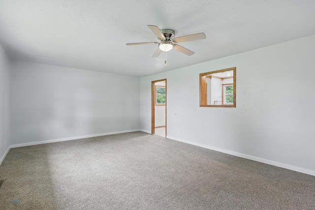 14289 Bethel Rd, Seneca, MO 64865 - carpeted empty room with a ceiling fan and baseboards